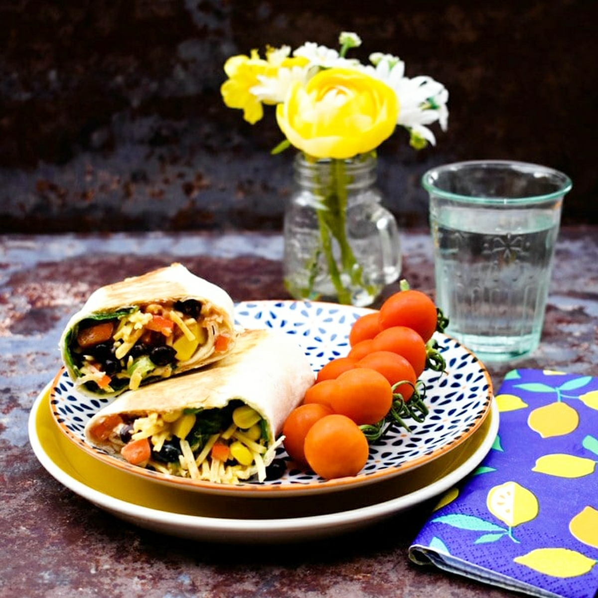 Tex Mex Cheese Crunch Wrap on a plate with cherry tomatoes.