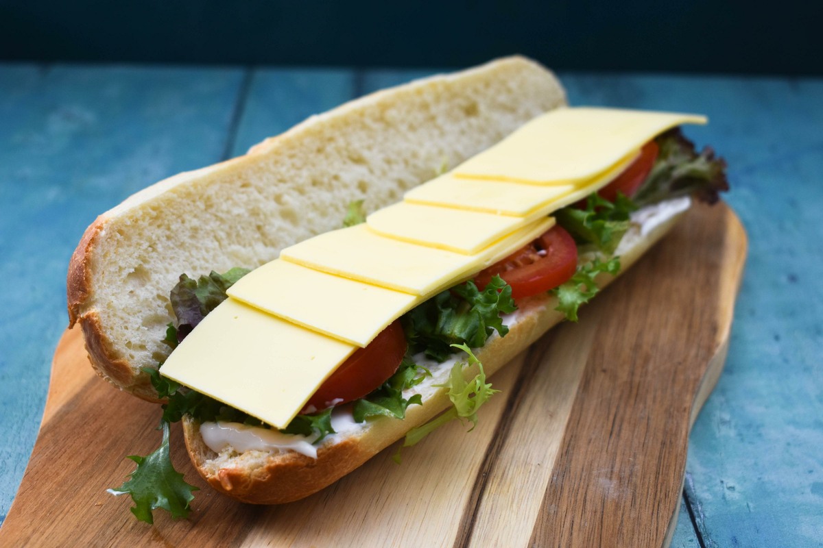 British Ploughman's Sandwich step 3 - add slices of cheese.