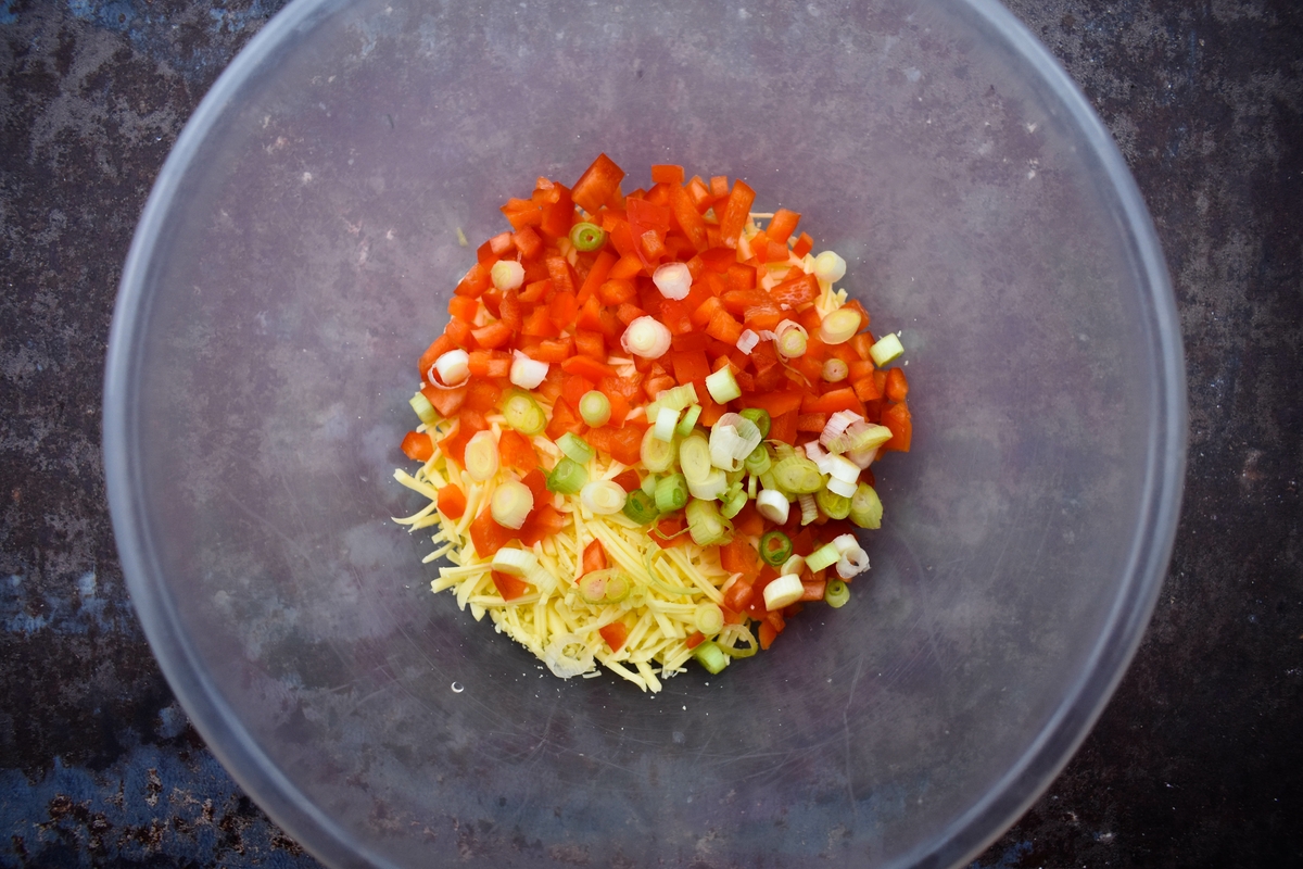 Tex Mex Cheese Crunch Wrap - step 1 - add cheese, red pepper and spring onion to a bowl.