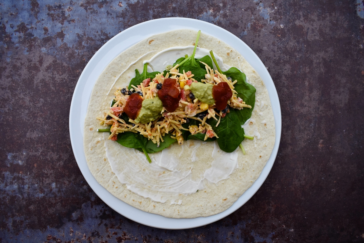 Tex Mex Cheese Crunch Wrap - step 5 - Add salsa and guacamole, then fold up into a burrito shape.