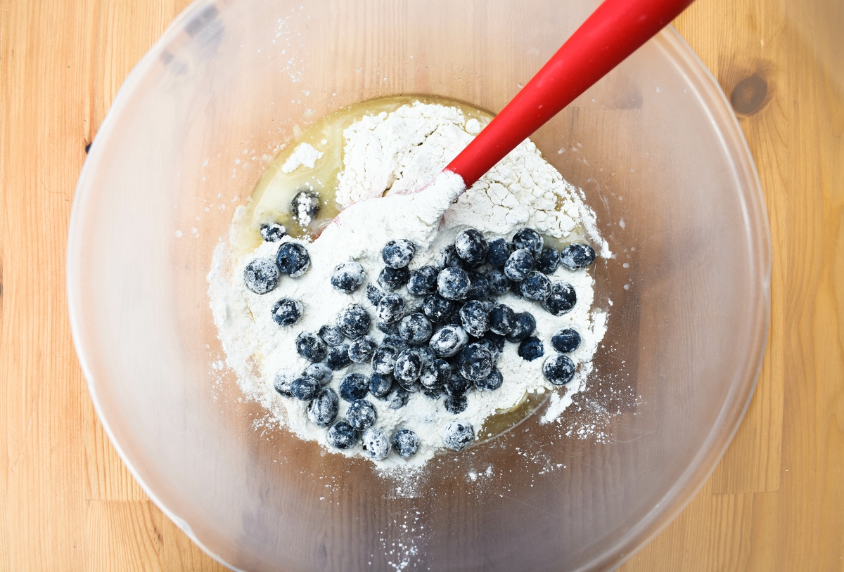blueberry muffins step 5 - add the blueberries to the batter mixture.