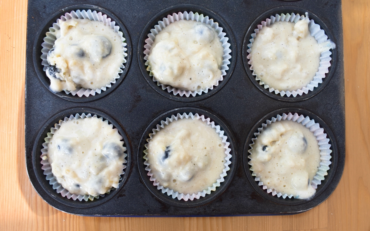 blueberry muffins step 7 - pour the batter into muffin cases.