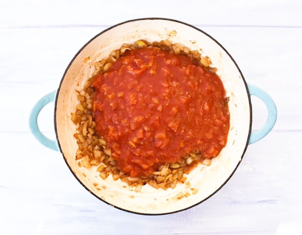 tomato soup step 3 - tomato puree and chopped tomatoes added.