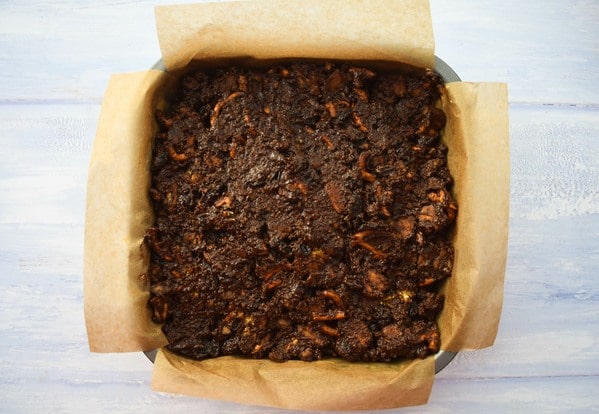 Mixture pressed into brownie tin.