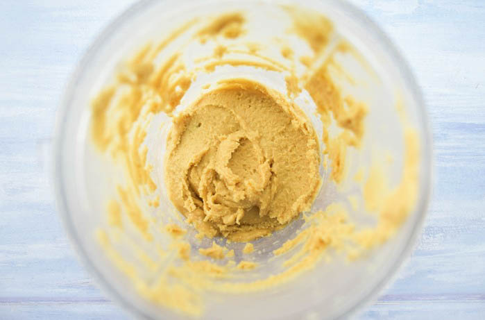 smooth peanut butter blended in a blender jug.