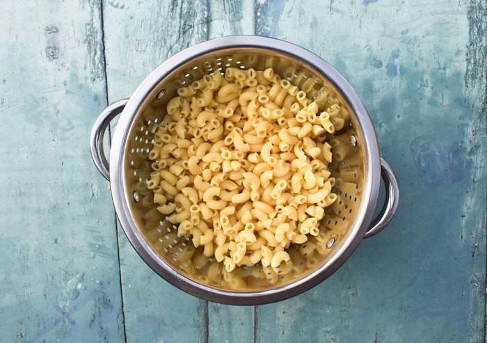 Making vegan macaroni step 1 - cooked and rinsed macaroni pasta.