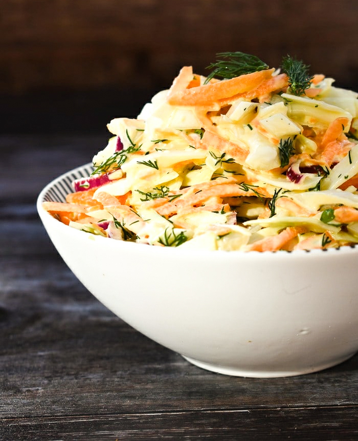 vegan carrot &  dill herb slaw in a bowl,