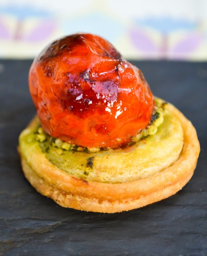 Close up of mini Tomato Pastry Bite on a slate board.
