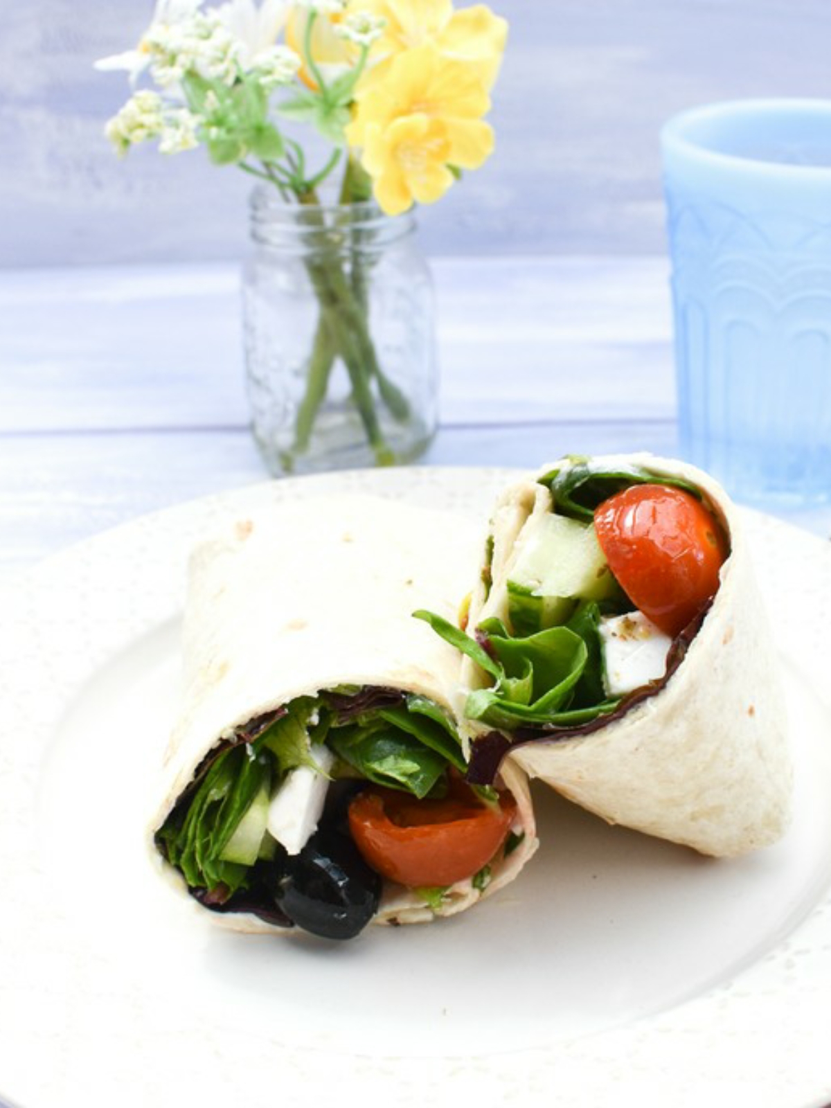 Vegan Greek Salad Lunch Wrap on a white plate