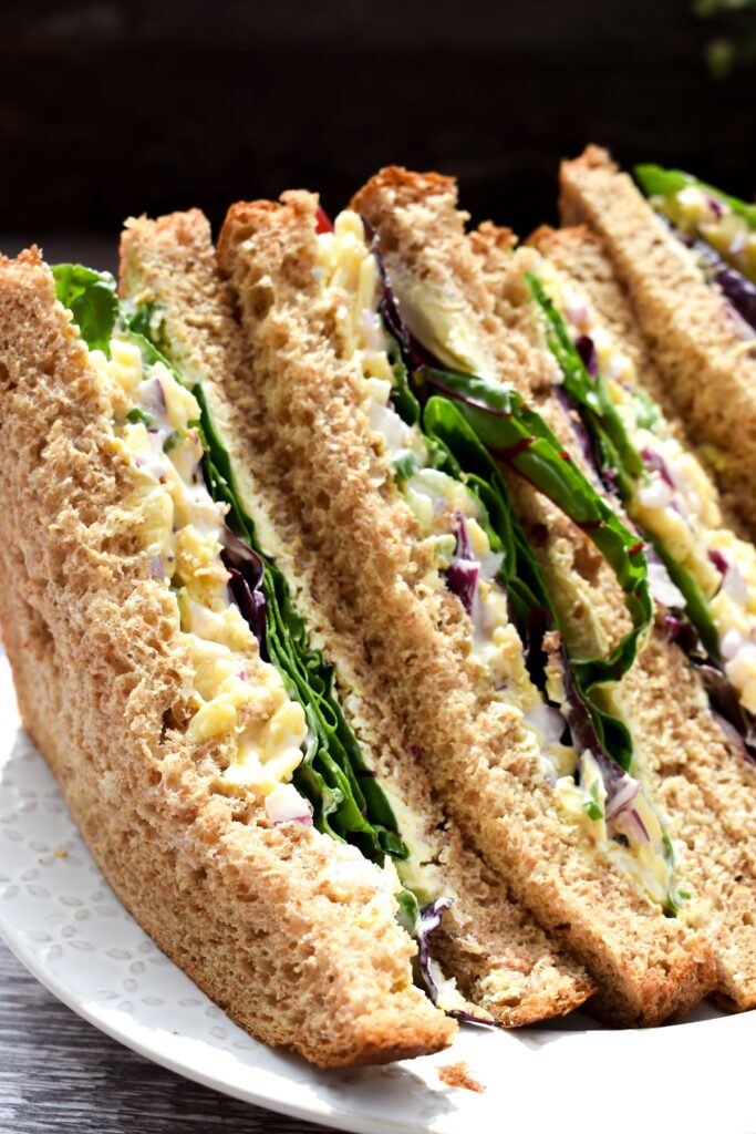 close up of a cheese and onion salad sandwich