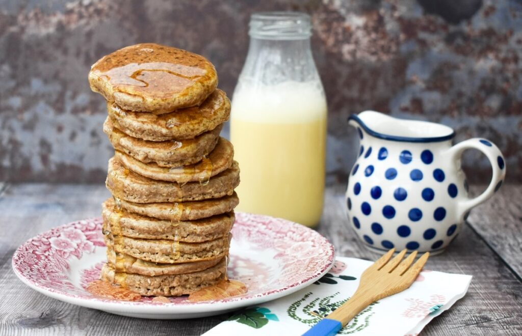 A stack of mini vegan oat and cinnamon pancakes