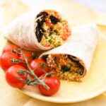 couscous wrap on a yellow plate