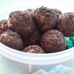 Vegan Chocolate Chickpea Truffles (Protein Snack) in a tub.