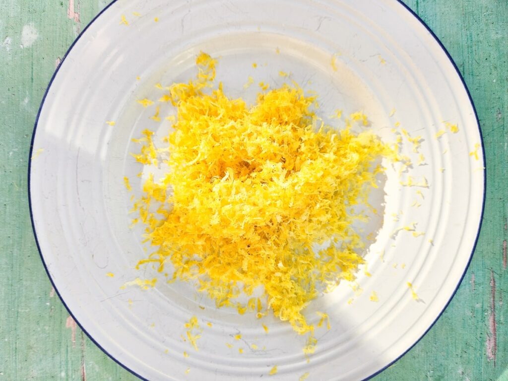 Lemon zest on a tea plate.