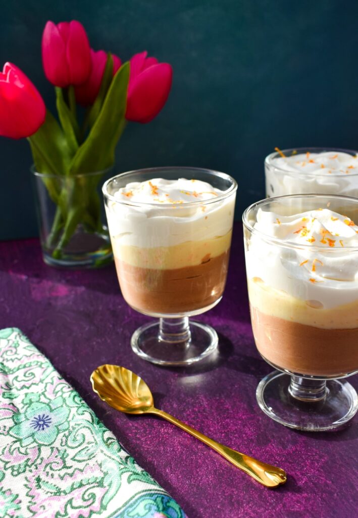 Creamy Chocolate Orange Mousse served in wine glasses.