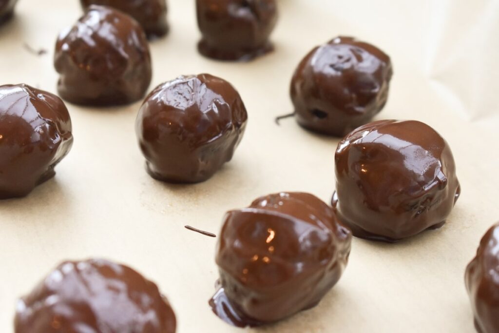 Healthy Brownie Bites dipped in melted chocolate