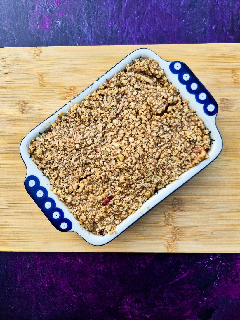 Flapjack mixture pressed into buttered ceramic dish.