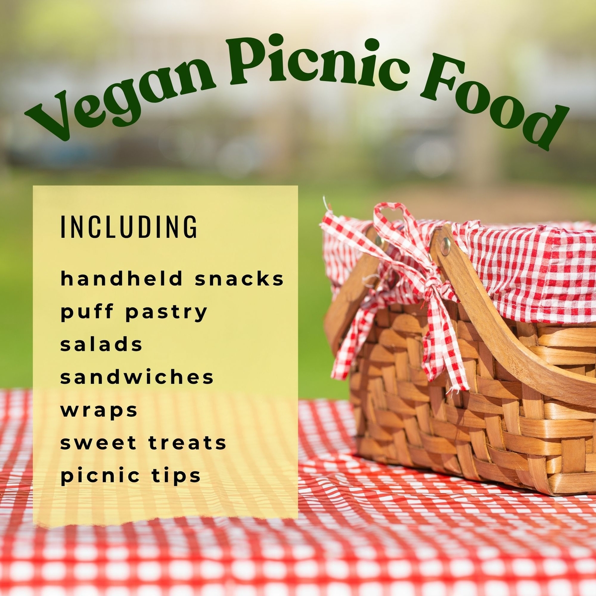 Picnic basket on checked cloth on grass in park.