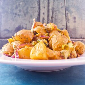 Delicious vegan Thousand Island Potato Salad Stacked on a plate.