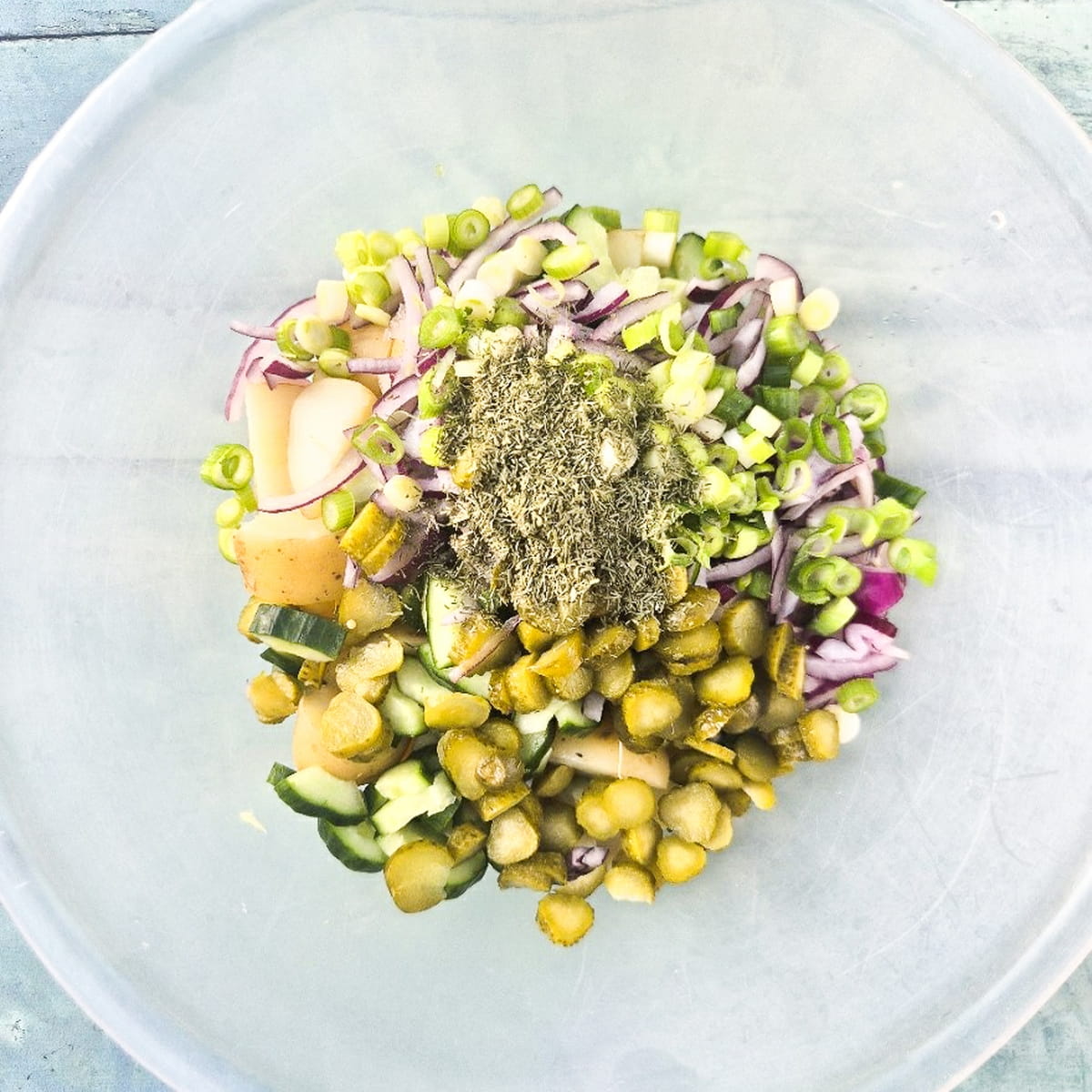 thousand island potato salad - step 5 - add the spring onion, pickles, herbs and seasoning.